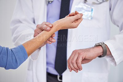 Buy stock photo Doctor, hands and wrist pulse for heart rate consultation in hospital for blood pressure examination, diagnosis or test. Person, patient and professional help for illness symptoms, advice or clinic