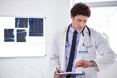 Buy stock photo Doctor, man and check time in hospital with clipboard for neurology with thinking, schedule or planning. Medic, checklist and watch or wristwatch with document, idea or review for healthcare results