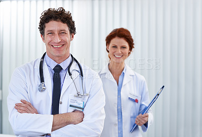 Buy stock photo Doctors, man and woman with arms crossed in portrait for team, partnership or smile with pride for healthcare. Medic employees, people and happy with collaboration for wellness, services and clinic