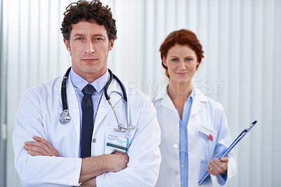 Buy stock photo Cropped shot of two doctors standing together at work