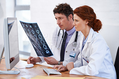 Buy stock photo Cropped shot of two doctors hard at work