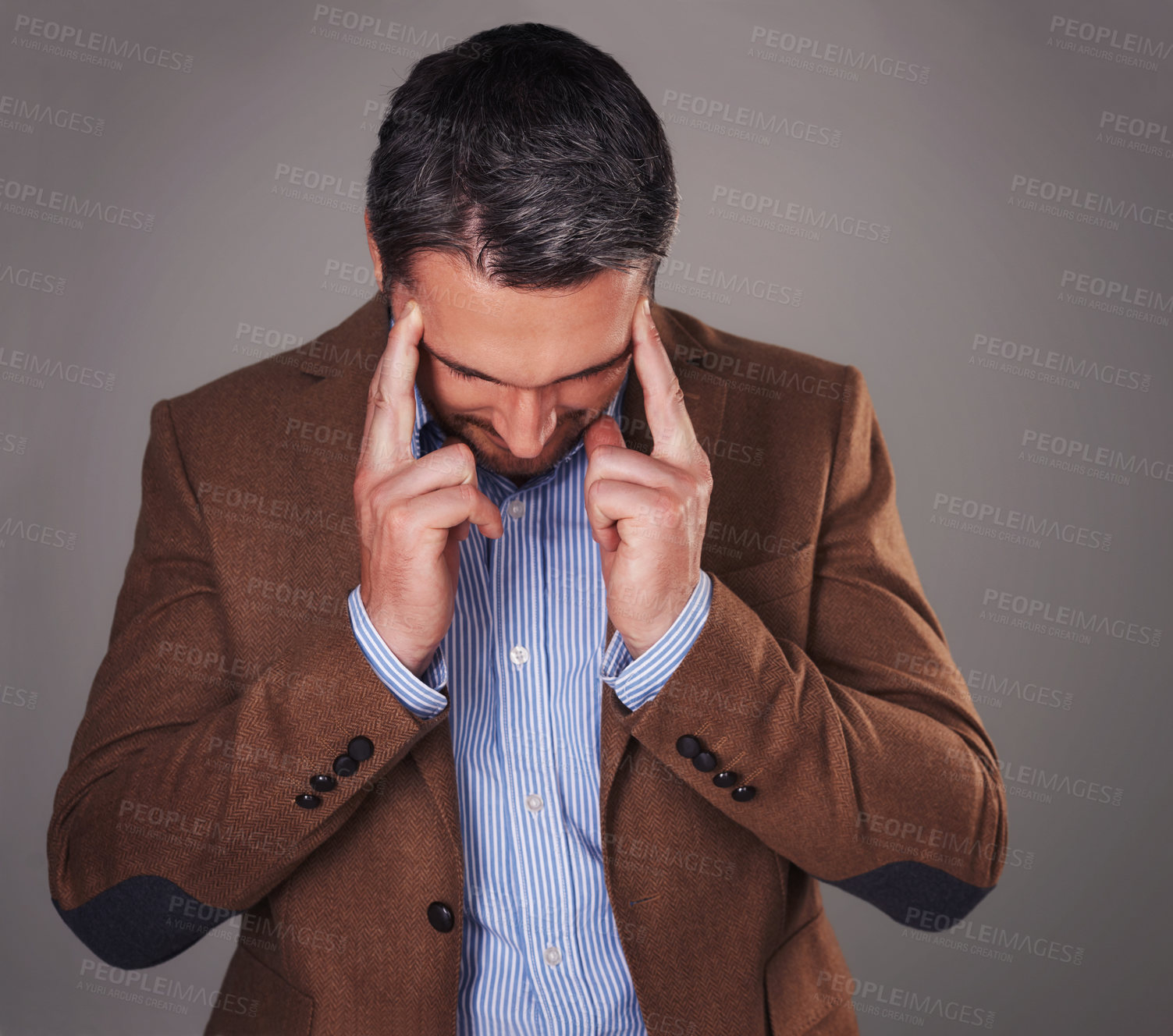Buy stock photo Business man, headache and stress in studio, burnout and fear or temple massage for pain. Male person, migraine and gray background for mental health, frustration and overwhelmed by pressure
