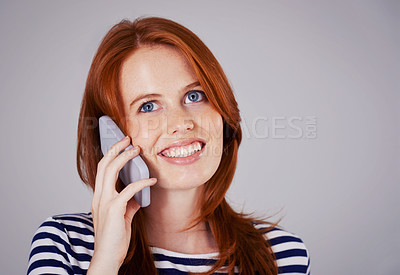 Buy stock photo Woman, phone call and network for communication in studio, internet and smile for conversation or chat. Happy female person, mockup space and voip for speaking on gray background, talking and online