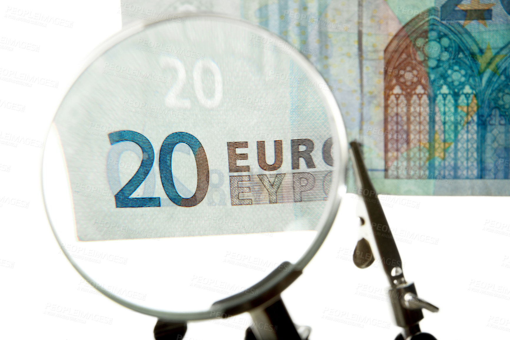 Buy stock photo Shot of a 20 euro bill under a magnifying glass 