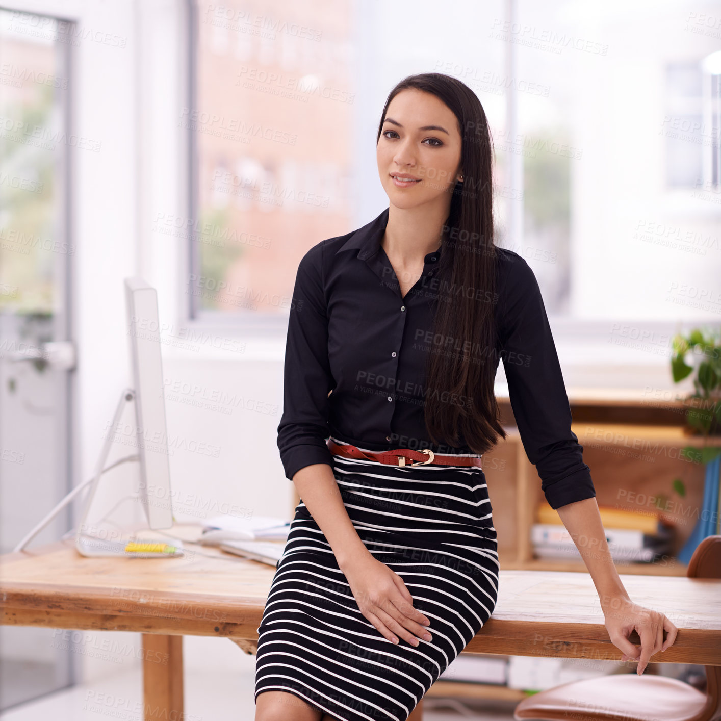 Buy stock photo Shot of a young businesswoman in her office