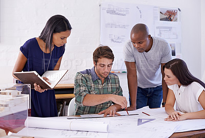 Buy stock photo Architecture, people and teamwork with drawing on blueprint in office for building design, remodeling project and layout plan. Collaboration, architect and employees with development planning meeting