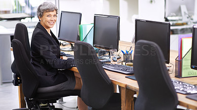 Buy stock photo Senior, business woman and portrait with computer at agency for communication or networking at office. Mature female person, agent or employee with smile on desktop PC for customer service or support