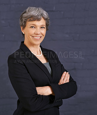 Buy stock photo Senior woman, arms crossed in portrait and corporate professional with smile, pride and job satisfaction on wall background. Manager, confident and realtor in London with ambition and happy in career