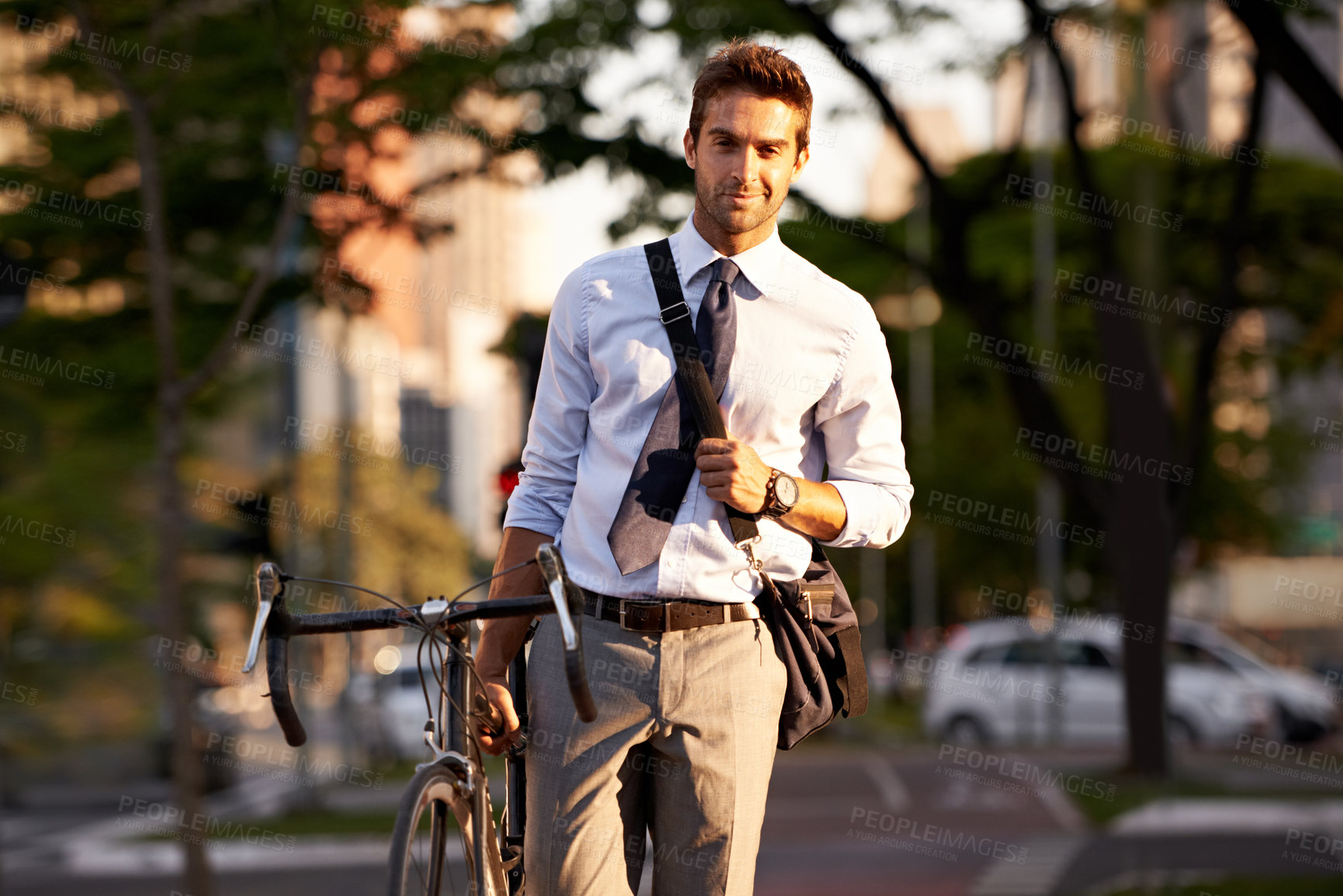 Buy stock photo Bicycle, city and portrait of businessman in morning for travel, commute and walking to work. Professional, urban town and happy person with bike for cycling, sustainable and eco friendly transport