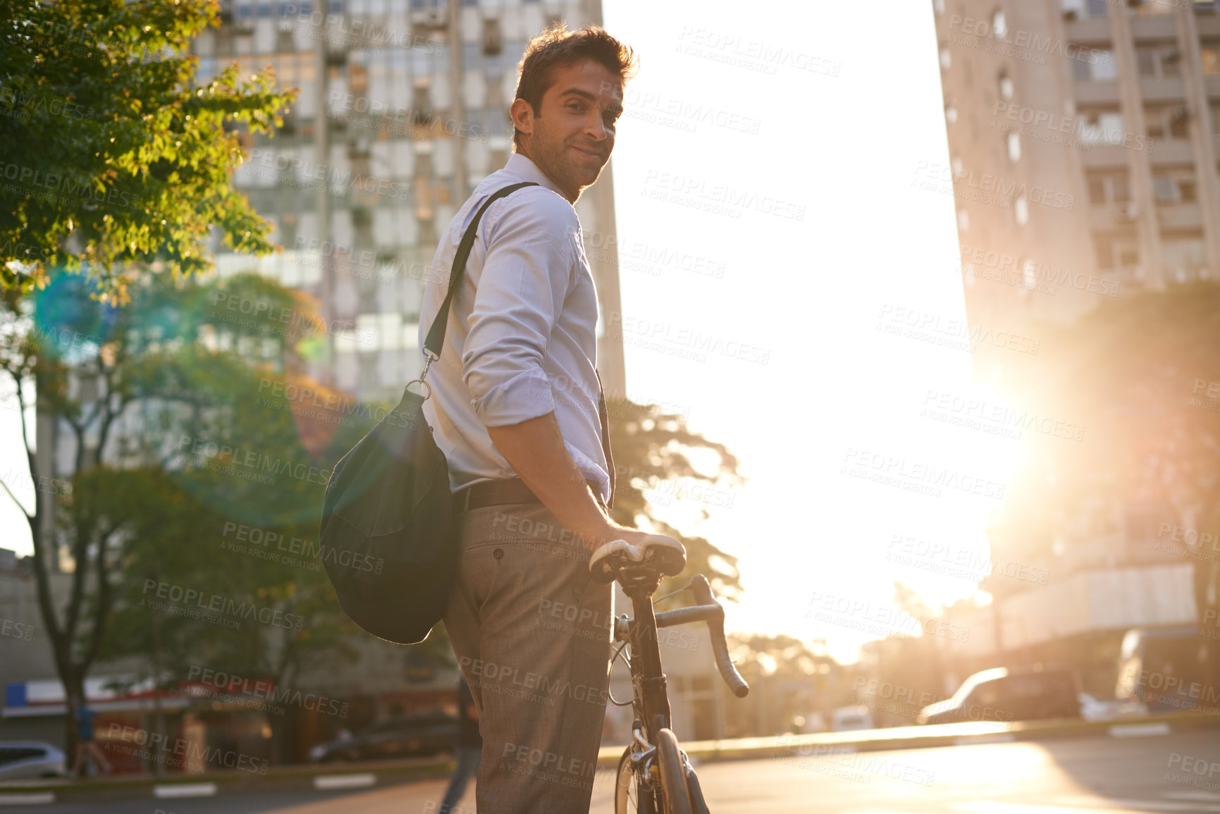 Buy stock photo Shot of a businessman commuting to work with his bicycle