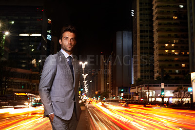 Buy stock photo Businessman, portrait and city lights at night with traffic as financial advisor for corporate professional, building or late. Male person, face and suit with motion blur on urban, street or commute