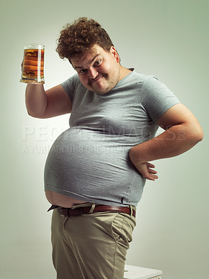 Buy stock photo Obese, weight gain and beer for man in studio with alcohol for unhealthy habit, plus size and humor. Overweight person with glass in hand and fat stomach for cheers and comedy for comic expression