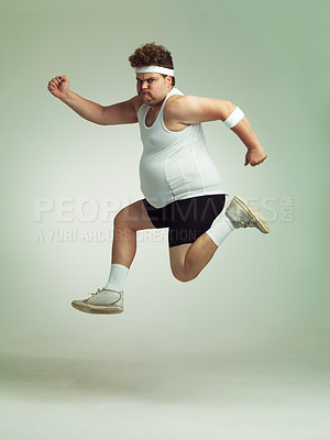 Buy stock photo Overweight man leaping in the air with his sense of achievement