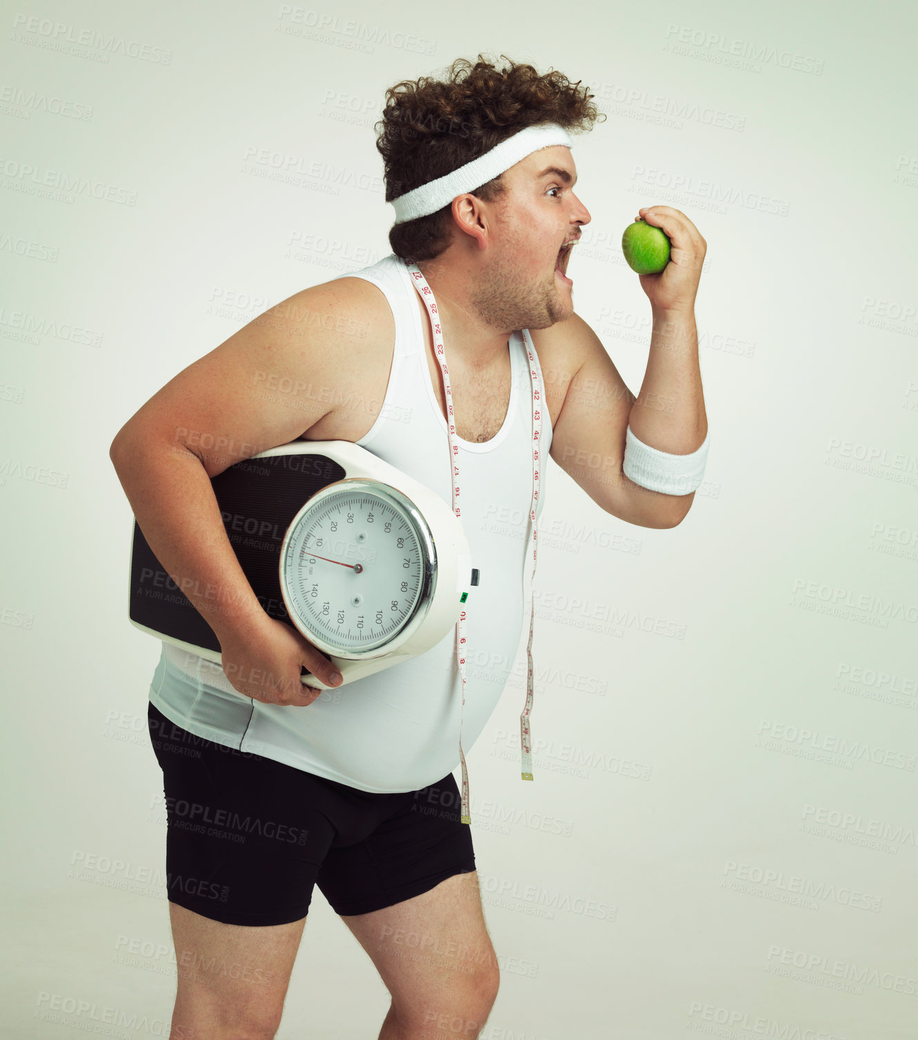 Buy stock photo Scale, man and apple for health, fitness or nutrition isolated on a gray studio background mockup. Plus size, eating fruit and healthy diet for weight loss of body of funny person with tape measure