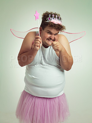 Buy stock photo An overweight man with a naughty expression wearing a pink fairy costume