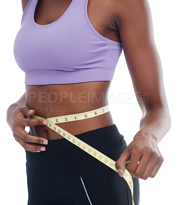 Buy stock photo Hands, waist and measuring tape with body of person in studio isolated on white background for weight loss. Exercise, fitness or wellness with sports woman tracking progress of diet and training