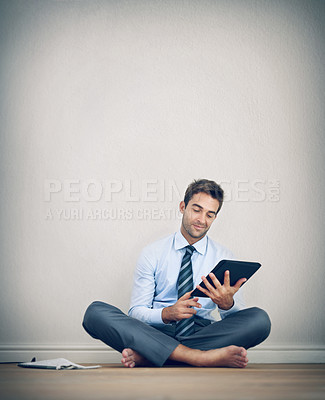 Buy stock photo Tablet, floor and business man in office with wall background for ideas, solution and brainstorming. Corporate, thinking and happy worker sitting with digital tech for internet, research and website