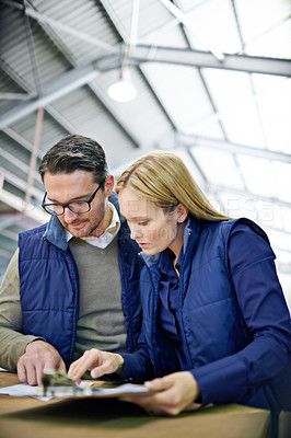 Buy stock photo Business people, clipboard and checklist with inventory for storage control in supply chain at warehouse. Young coworkers, team or employees reading documents or paperwork for distribution at factory