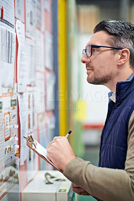 Buy stock photo Paper, man and bulletin board for work schedule or calendar for shipping details, supplier information and warehouse. Male person, clipboard and notes for orders or inventory, poster and distribution