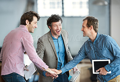 Buy stock photo Hands in a huddle as a business man and his colleagues or coworkers cheer and celebrate success, a win or career achievement. Cheering and celebrating victory as a team or group in their work office