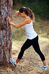 Young woman stretching her feet