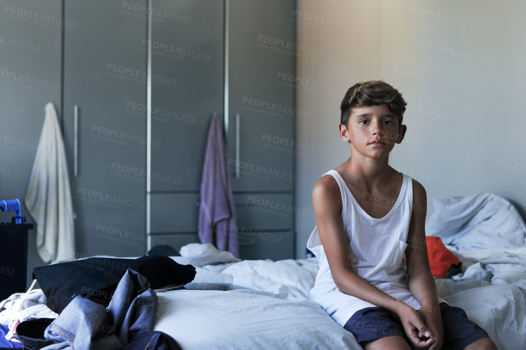 Buy stock photo Portrait of a young boy sitting in his bedroom at home