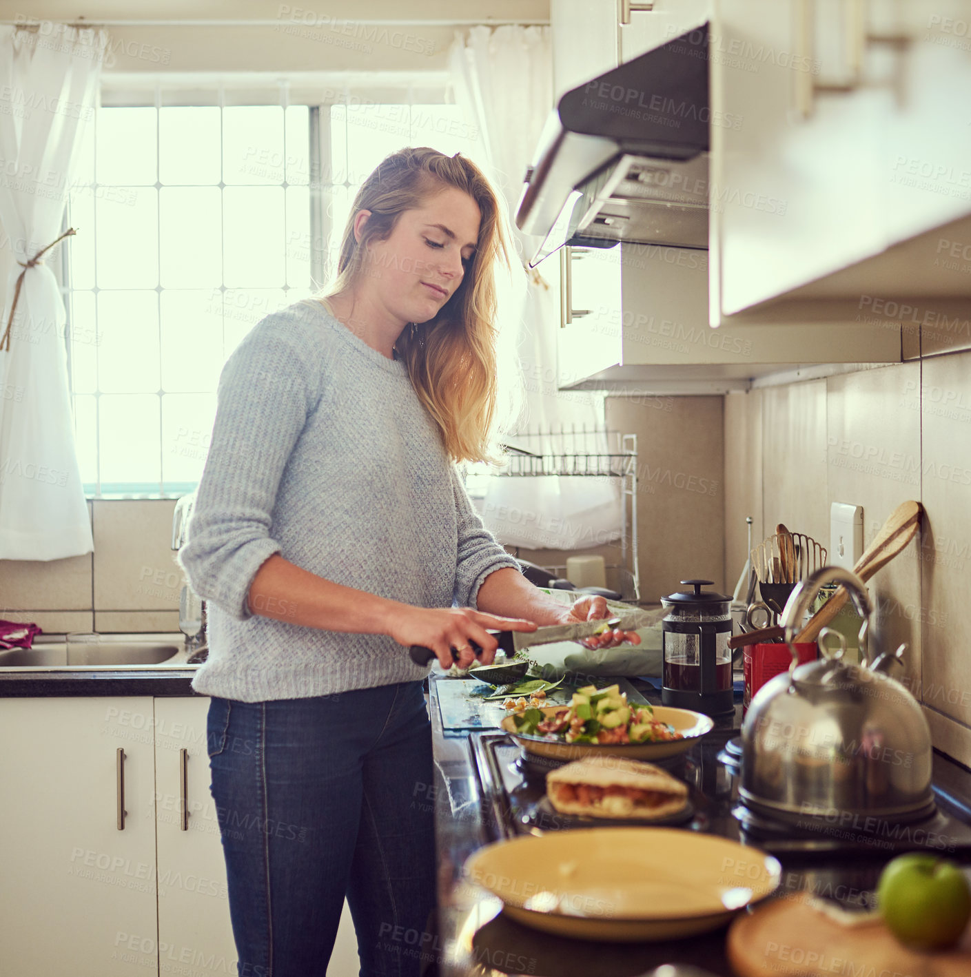Buy stock photo Girl, morning and cooking breakfast in kitchen for daily routine for healthy eating or living with diet, nutrition and food. Woman, home and casual for preparing meal with knife for cutting vegetable