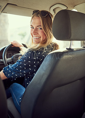 Buy stock photo Portrait of an attractive young woman driving a car