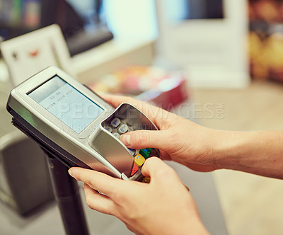 Buy stock photo Closeup shot of a person typing their pin number into a credit card machine at a grocery store