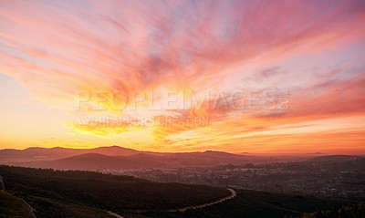 Buy stock photo Nature, sunset and mountain valley for horizon, peace and location of sustainable environment. Skyline, calm and dusk in outdoor for tourism aesthetic, travel and color in clouds for ecosystem 