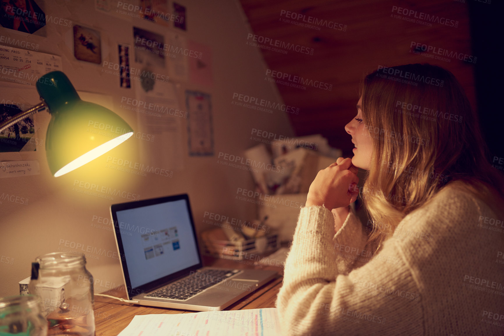 Buy stock photo Studying, girl and laptop at desk at night for assessment, exams and thinking in bedroom. Computer, lamp and female student in dark for education, learning and research for assignment or deadline