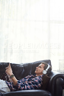 Buy stock photo Shot of a young man surfing the net at home