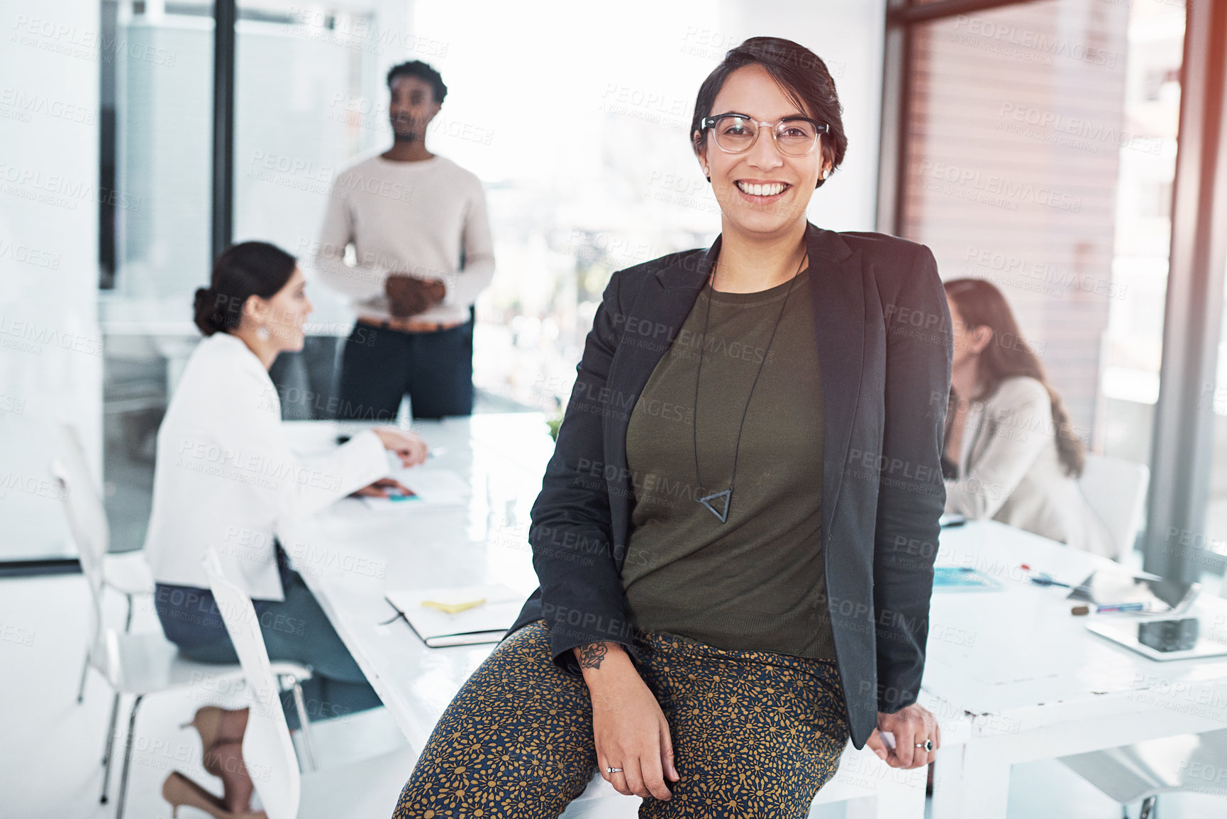 Buy stock photo Portrait, smile and woman on desk with leaning in boardroom for team, meeting and workplace. Female person, office and group in sales management for business, company or career with diversity