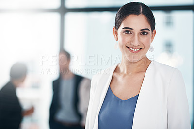 Buy stock photo Portrait of a businesswoman in an office with her colleagues in the background
