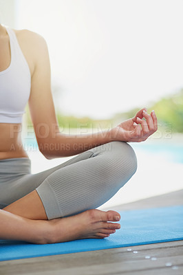 Buy stock photo Shot of an unrecognizable woman meditating on her patio