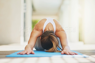 Buy stock photo Shot of a young woman working out at home