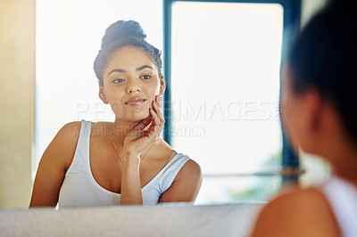 Buy stock photo Morning, skincare and girl in reflection of mirror cleaning face with dermatology or cosmetics. Natural, beauty and calm woman in bathroom with healthy glow from organic facial and sunscreen on skin