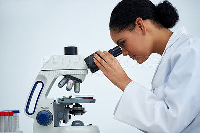 Buy stock photo Cropped shot of an attractive young female scientist working in her lab