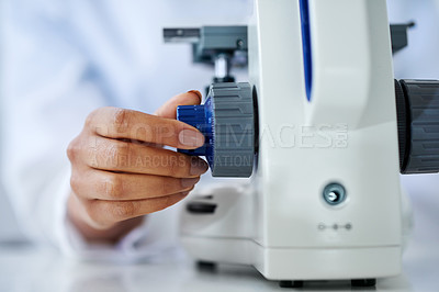 Buy stock photo Cropped shot of an unrecognizable female scientist working in her lab