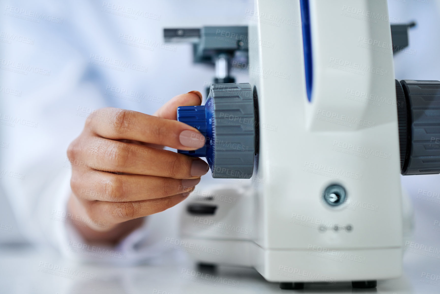 Buy stock photo Cropped shot of an unrecognizable female scientist working in her lab