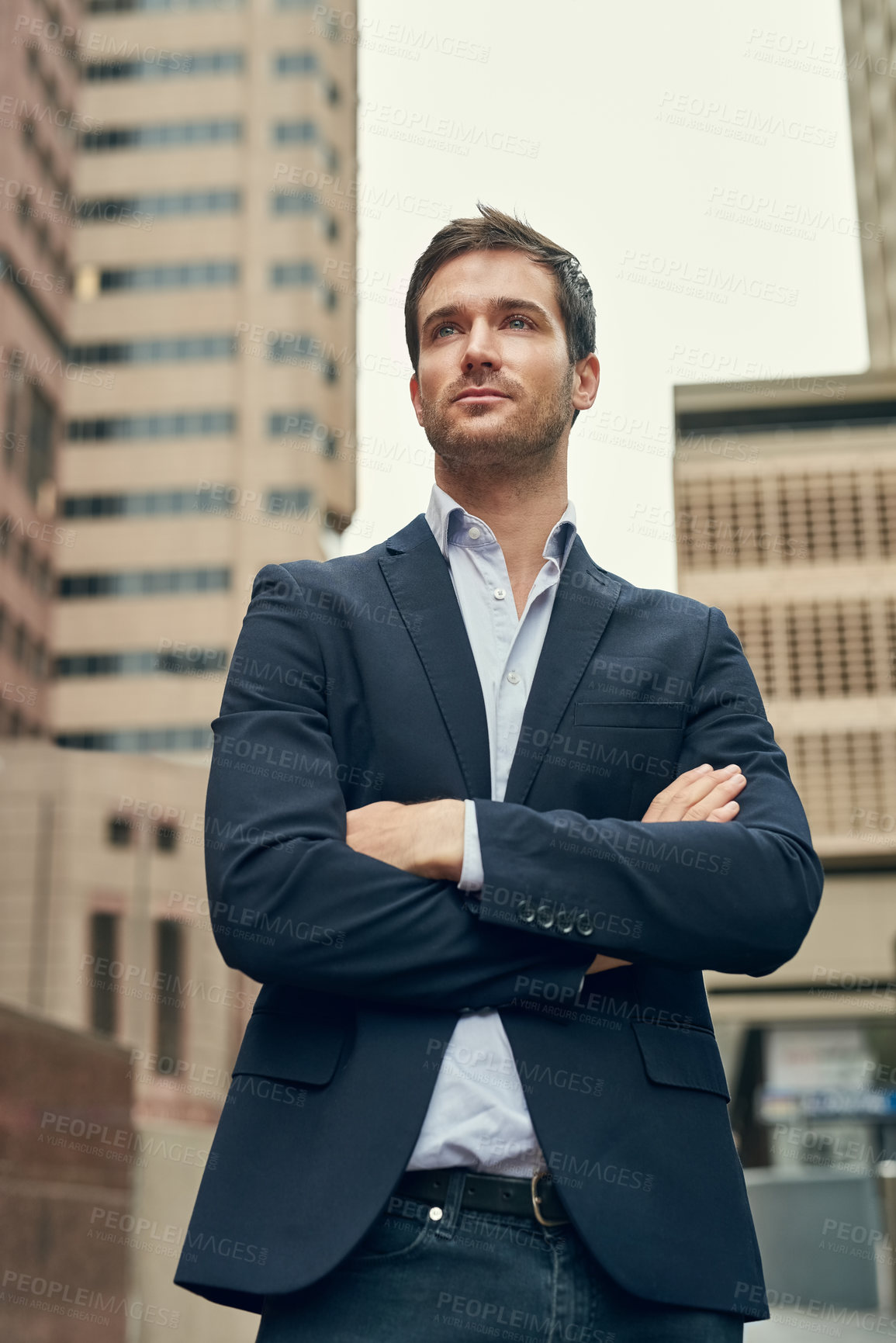 Buy stock photo Cropped shot of a confident young businessman out in the city