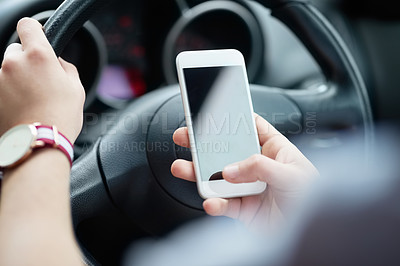 Buy stock photo Closeup shot of an unrecognizable man using his cellphone while driving