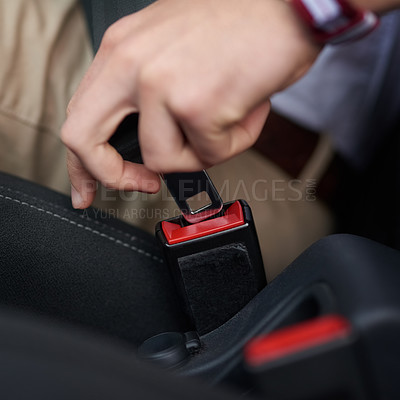Buy stock photo Shot of an unidentifiable person buckling up