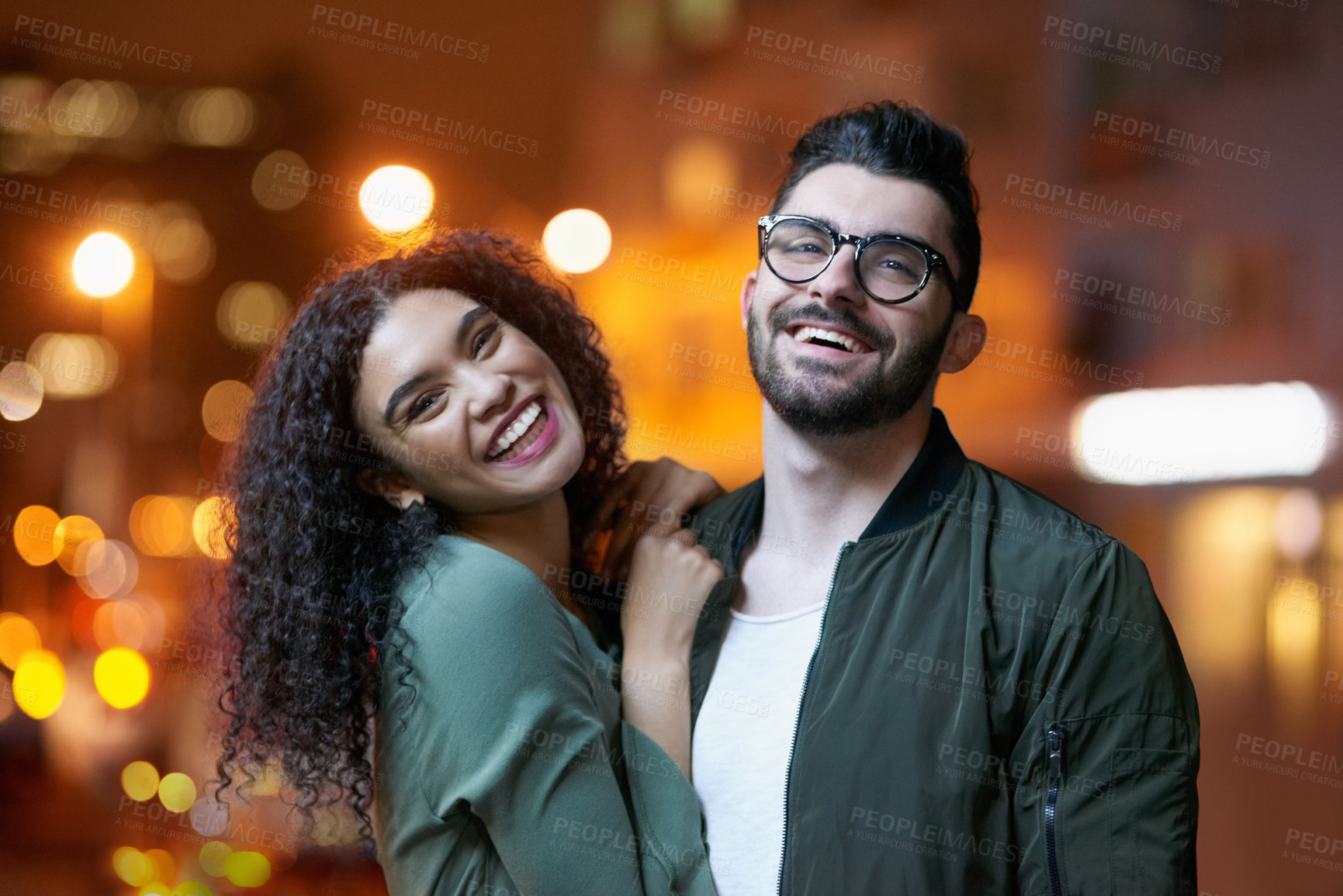 Buy stock photo Portrait of a happy young couple outdoors at night