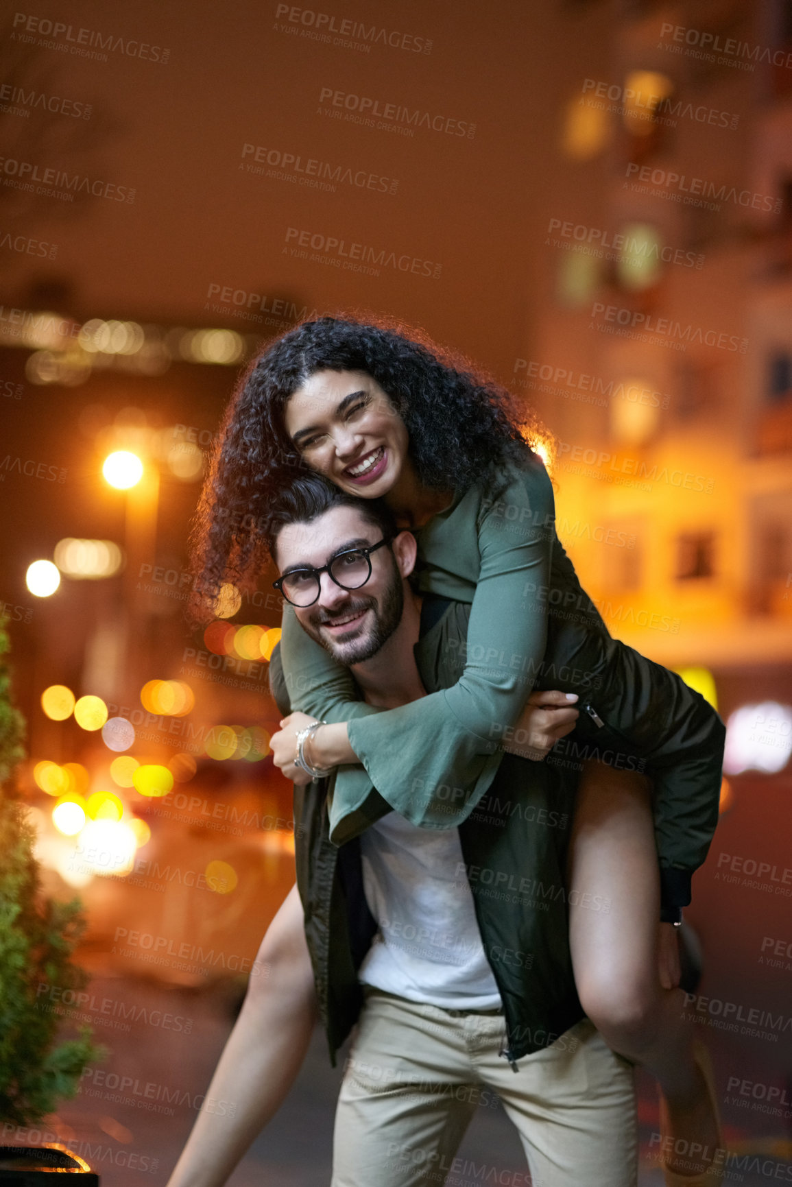 Buy stock photo Portrait, city and happy couple with piggyback for love, date night and relationship with support and romance. Outdoor, man and woman for hug with smile, evening walk together and trust in New York