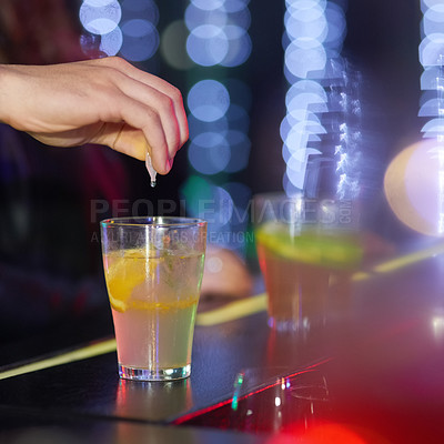 Buy stock photo Closeup shot of a man drungs into a drink in a nightclub