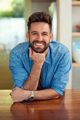 Buy stock photo Portrait of a happy man leaning against a counter at home