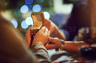 Buy stock photo Cropped shot of a man proposing to his girlfriend