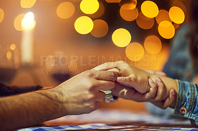 Buy stock photo Cropped shot of a man proposing to his girlfriend