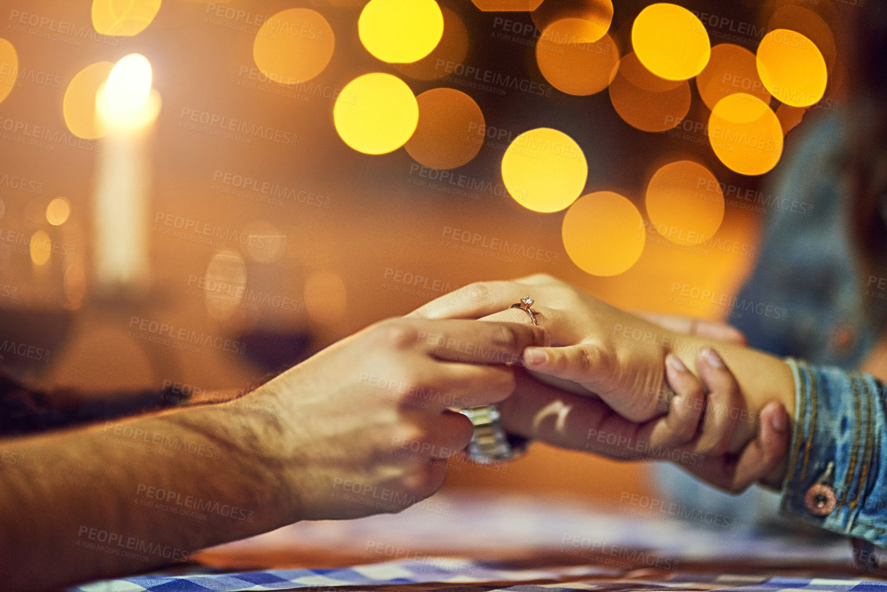 Buy stock photo Cropped shot of a man proposing to his girlfriend